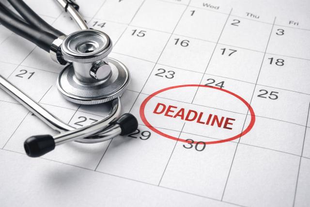 calendar with a red deadline date marked and a stethoscope, representing legal time limits